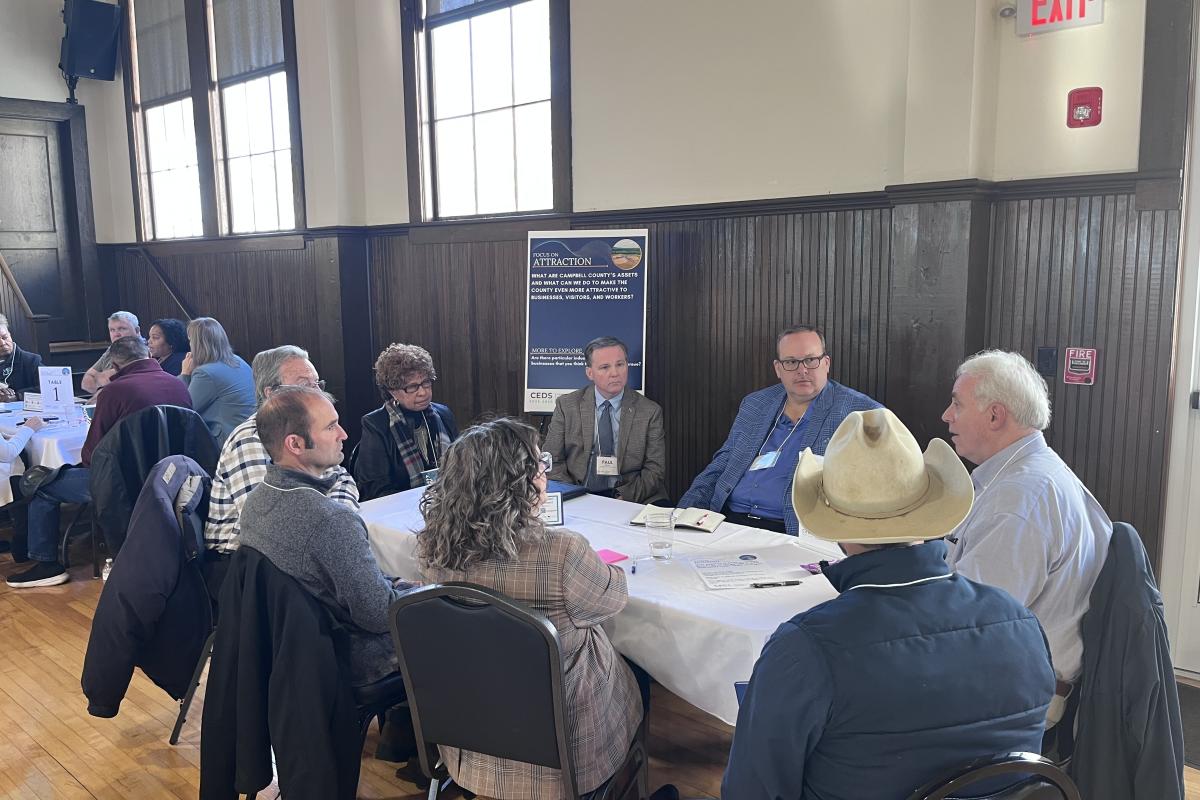 Group at a Table Having a Discussion at the Economic Development Summit