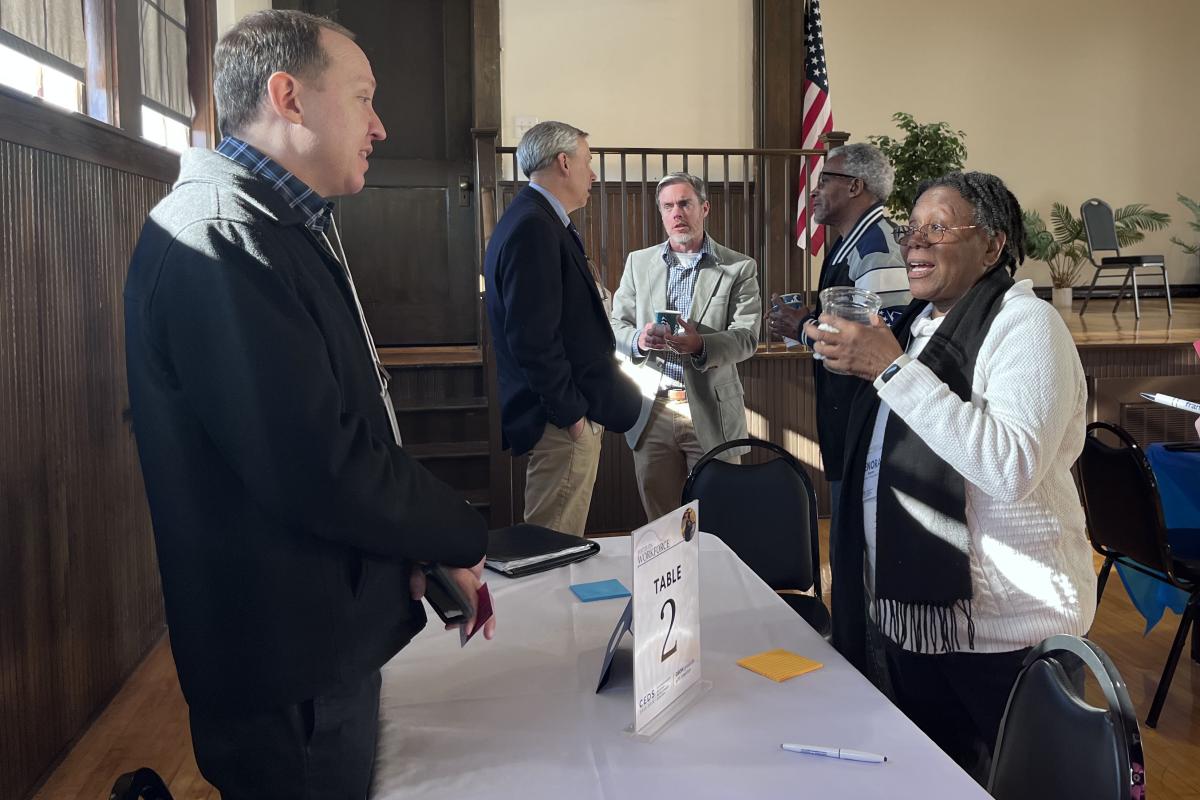 Group Chats Around Table 2 at the Economic Development Summit