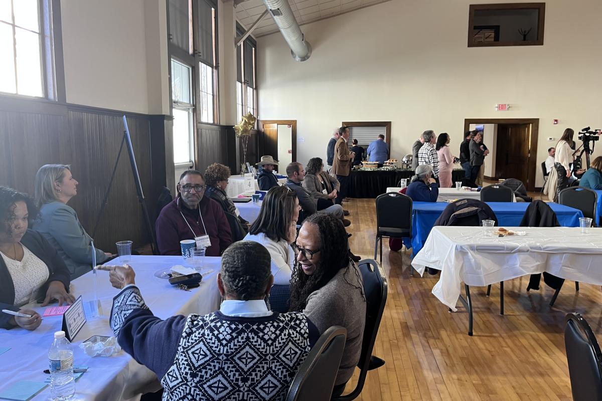 People Sitting at the Tables at the Economic Development Summit
